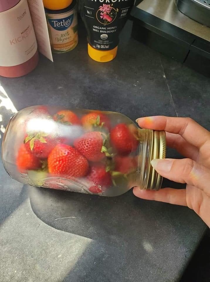 Strawberries in Glass Jars